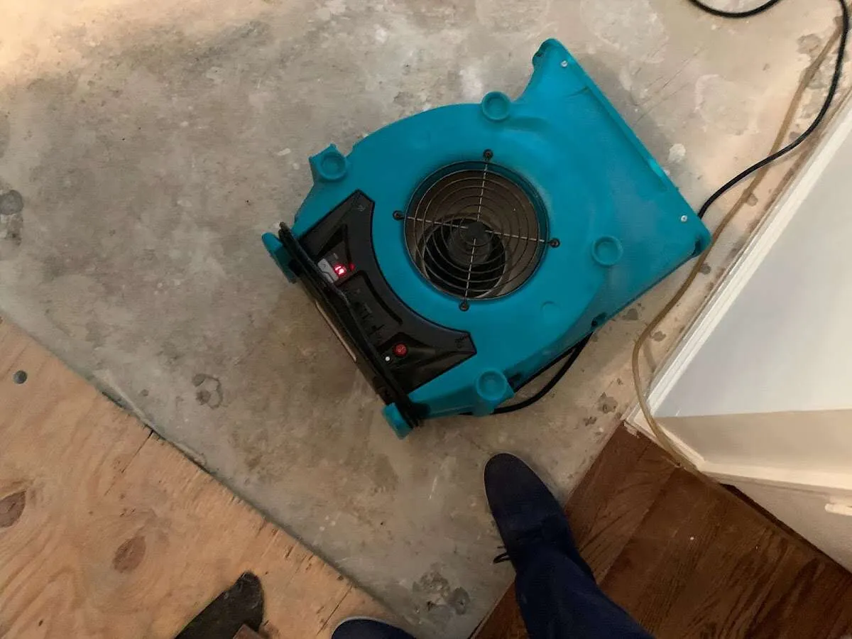 Air mover drying subfloor during Leak Detection & Repair in Tredyffrin